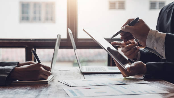 Reviewing marketing results on a laptop and tablet